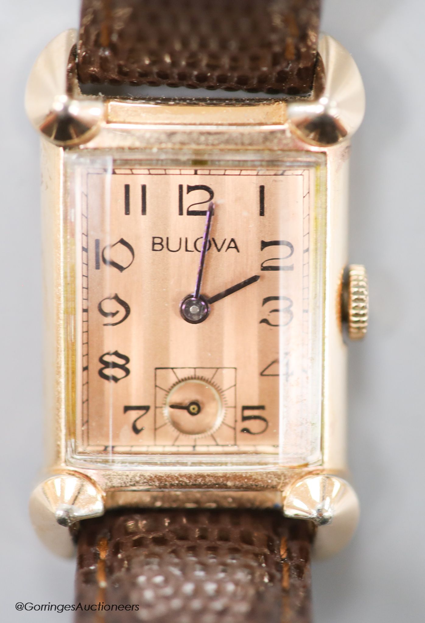 A gentleman's 1930's 14k gold filled Bulova manual wind rectangular dial wrist watch, with subsidiary seconds, on later leather strap.